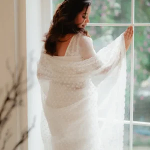 White polka dot net saree with pearl embroidered border
