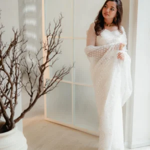 White polka dot net saree with pearl embroidered border