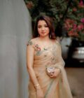 Ivory Beige Organza Saree with Multicolor Floral Embroidery & Teal Border